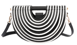 A black and white striped cresent shaped handbag with a top handle and a detachable shoulder strap.